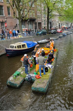 AMSTERDAM, NETHERLANDS - APRIL 30. Young People Celebrating Queensday in Amsterdam. Queensday is a popular annual festival celebrating the Queens Birthday.のeditorial素材