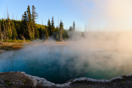 A sunrise in the West Thumb Area in Yellowstone National Parkの写真素材