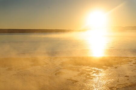 A sunrise in the West Thumb Area in Yellowstone National Parkの写真素材