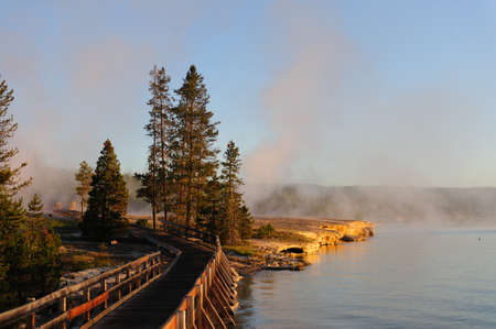 A sunrise in the West Thumb Area in Yellowstone National Parkの写真素材