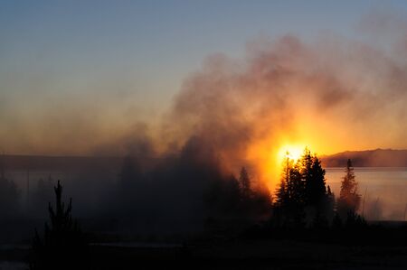 A sunrise in the West Thumb Area in Yellowstone National Parkの写真素材