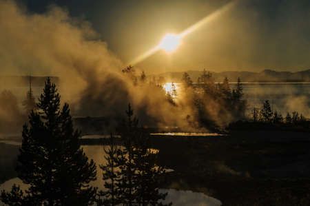 A sunrise in the West Thumb Area in Yellowstone National Parkの写真素材