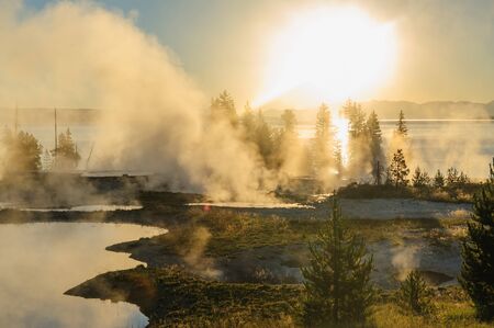 A sunrise in the West Thumb Area in Yellowstone National Parkの写真素材