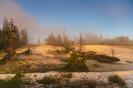 A sunrise in the West Thumb Area in Yellowstone National Parkの写真素材