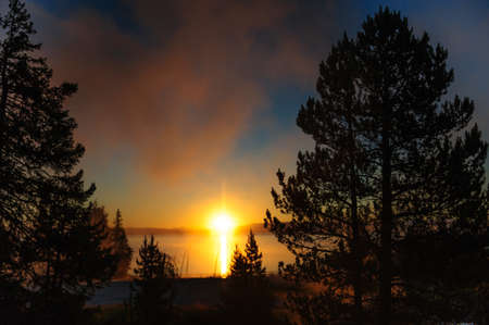 A sunrise in the West Thumb Area in Yellowstone National Parkの写真素材