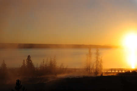 A sunrise in the West Thumb Area in Yellowstone National Parkの写真素材