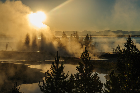 A sunrise in the West Thumb Area in Yellowstone National Parkの写真素材