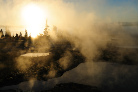 A sunrise in the West Thumb Area in Yellowstone National Parkの写真素材