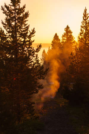 A sunrise in the West Thumb Area in Yellowstone National Parkの写真素材