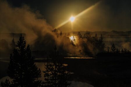 A sunrise in the West Thumb Area in Yellowstone National Parkの写真素材