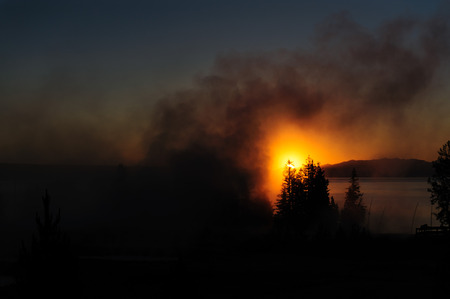 A sunrise in the West Thumb Area in Yellowstone National Parkの写真素材