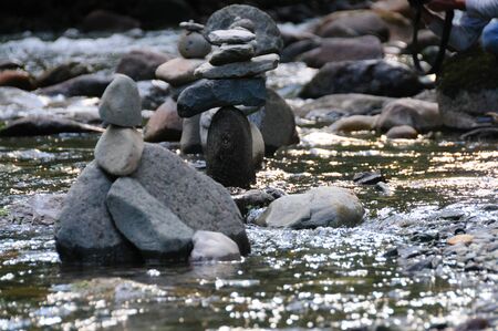 Rock Stacks in the The Colitz River near the La Wis Wis Campground in the state of Washintonの写真素材