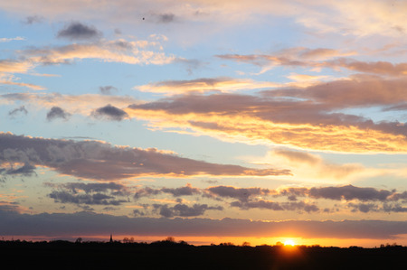 Eerie Sky over Friesland during the early evening. sunset.の写真素材