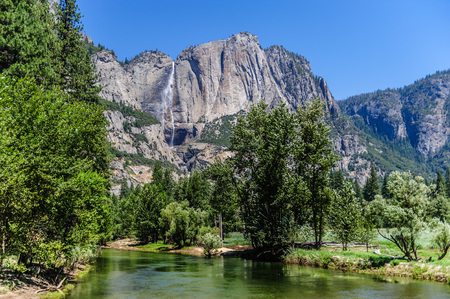 The Merced river on a late July afternoon, with the upper yosemite falls in the background. Yosemite National Park, California, USA.の写真素材