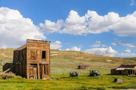 Ruined Buildings in the Californian Ghost Town of Bodie. Bodie is one of the best preserved Ghost Towns in America and was founded during the Californian Gold Rush. It was inhabited until the 1970s.の写真素材