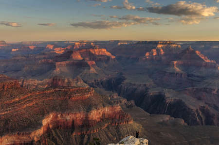 Sunrise over the Grand Canyon, on an early August Morning. The rising sun is casting long dramatic shadows over the Red Rocks of the Canyon. Grand Canyon National Park, Arizona, USA.の写真素材