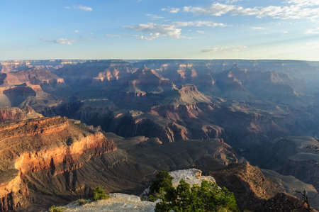 Sunrise over the Grand Canyon, on an early August Morning. The rising sun is casting long dramatic shadows over the Red Rocks of the Canyon. Grand Canyon National Park, Arizona, USA.の写真素材