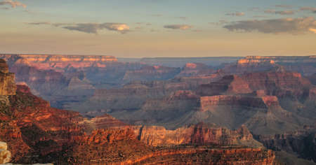 Sunrise over the Grand Canyon, on an early August Morning. The rising sun is casting long dramatic shadows over the Red Rocks of the Canyon. Grand Canyon National Park, Arizona, USA.の写真素材
