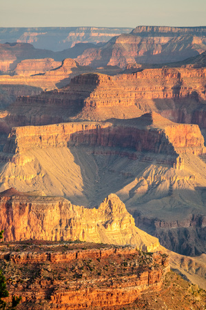 Sunrise over the Grand Canyon, on an early August Morning. The rising sun is casting long dramatic shadows over the Red Rocks of the Canyon. Grand Canyon National Park, Arizona, USA.の写真素材