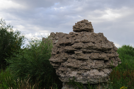 Classic sand stone formations, known as Tufa, higlighted along the coast line of Mono Lake, near the town of Lee Vining, in Eastern Californiaの写真素材