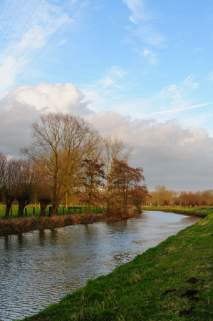 Sunset Along the Dender River in East Flanders, Belgiumの写真素材