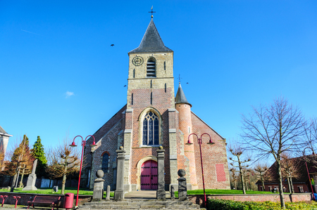 A Classic Church in the Flemish town of Schendelbeke. Image from a sunny winter afternoon.の写真素材