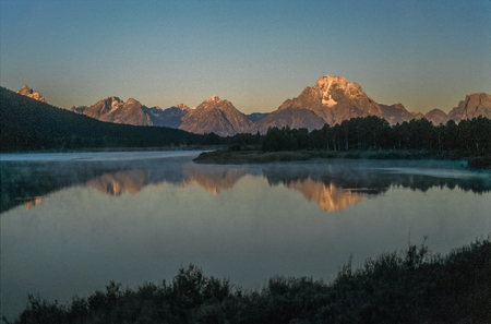 Sunrise at the Grand Teton Mountain range, mid September 2003.の写真素材