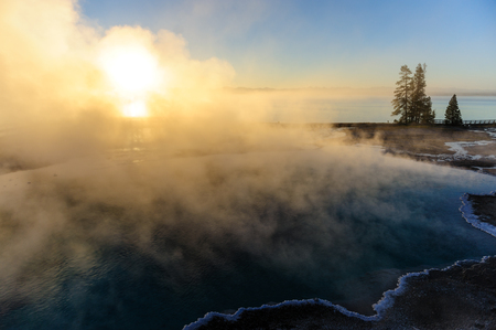 A sunrise in the West Thumb Area in Yellowstone National Parkの写真素材