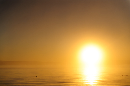 Sunrise over lake yellowstone on an early morming near the West Thumb erea.の写真素材