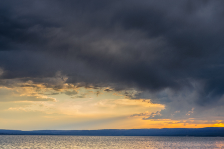 Illumination from the setting sun is reflected in the waves of Lake Yellowstone. Yellowstone National Park.の写真素材