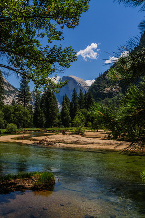 The Merced river on a sunny summers afternoon, flowing through Yosemite Valley. Yosemite National Park, California.の写真素材