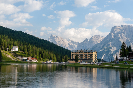 Imression of the buildings along the shoreline of Lake Misurina, in the Italian Dolomites, on a Summers Afternoon.の写真素材