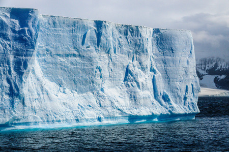 A giant tabular iceberg floating off the coast of Brown Bluff, the northern most tip of the Antarctic Peninsula.の写真素材