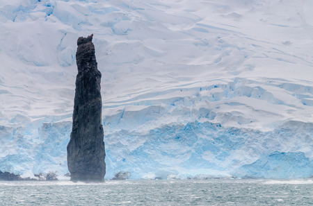 The Astrolabe Needle is a 50 meter tall monolith off the coast of Brabant island, near the Antarctic Peninsulaの写真素材