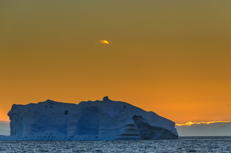 Antarctic Sunset: Floating Icebergs in the Weddell Sea, near the Antarctic Peninsula, as seen from an Antarctic Exploration Shipの写真素材