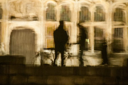 Reflection of a bicycle in the waters of a canal in the city center of Ghent.