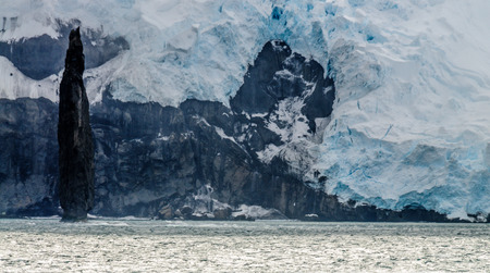 The Astrolabe Needle is a 50 meter tall monolith off the coast of Brabant island, near the Antarctic Peninsulaの写真素材