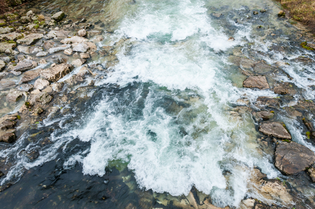 Water flowing on rocksの写真素材