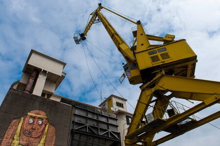 Ghent, Belgium. May 18, 2013. Wide angle shot of an old harbour crane in the old docks of Ghentのeditorial素材