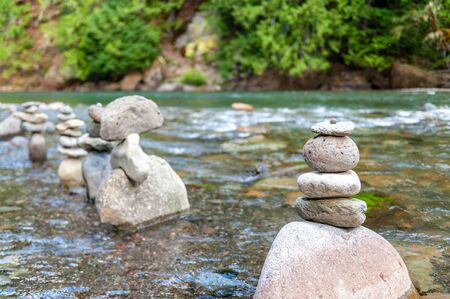 Boulders stacked into a formation of rocks in the Cowlitz river, near the La Wis Wis Campground. Washington State.の写真素材