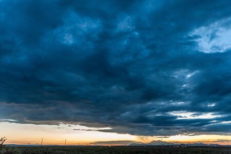 An impressive sky developing near meteor crater along route 66, US interstate 40.の写真素材