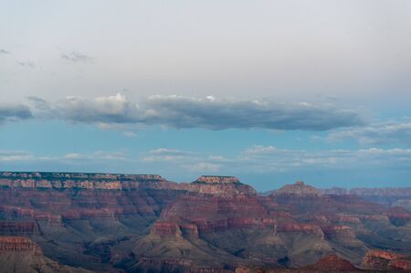 The setting sun sinking below the horizon of the Grand Canyon, near Yavapai point on the southern canyon rim.の写真素材