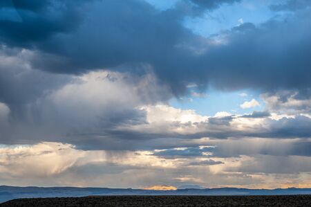 A dramatic sky higlighting the beauty of mono lake, California.の写真素材