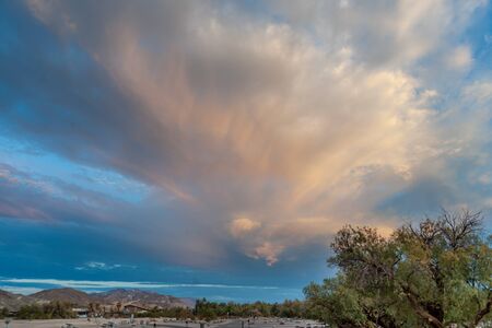 A sunset illuminating the skies over Furnace Creek, Death Valley National Parkの写真素材