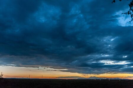 An impressive sky developing near meteor crater along route 66, US interstate 40.の写真素材