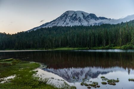 An impression of Mount rainier in the Evening light, reflected in a lake.の写真素材
