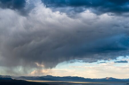 A dramatic sky higlighting the beauty of mono lake, California.の写真素材