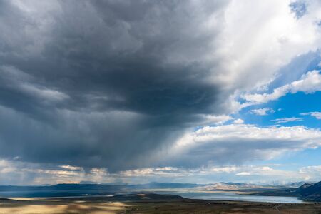 A dramatic sky higlighting the beauty of mono lake, California.の写真素材