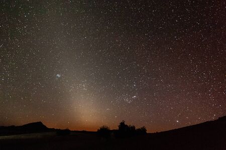The Zodaical light announging the arrival of dawn, near Cha-re, Khomas region Namibia.の写真素材