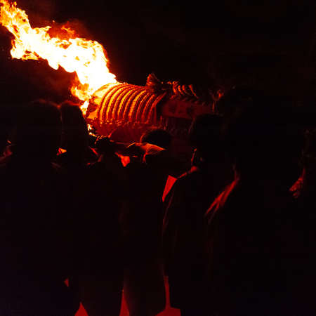 Miyajima, Japan - December 31, 2019. Participants of the Chinkasai Fire Festival at Itsukushima...